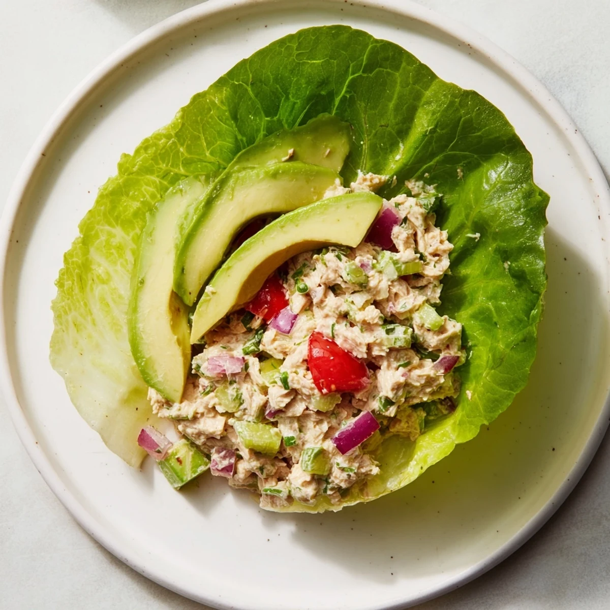 Fresh Quick & Healthy Tuna Salad Lettuce Wraps, filled with creamy tuna and avocado, ready to eat.