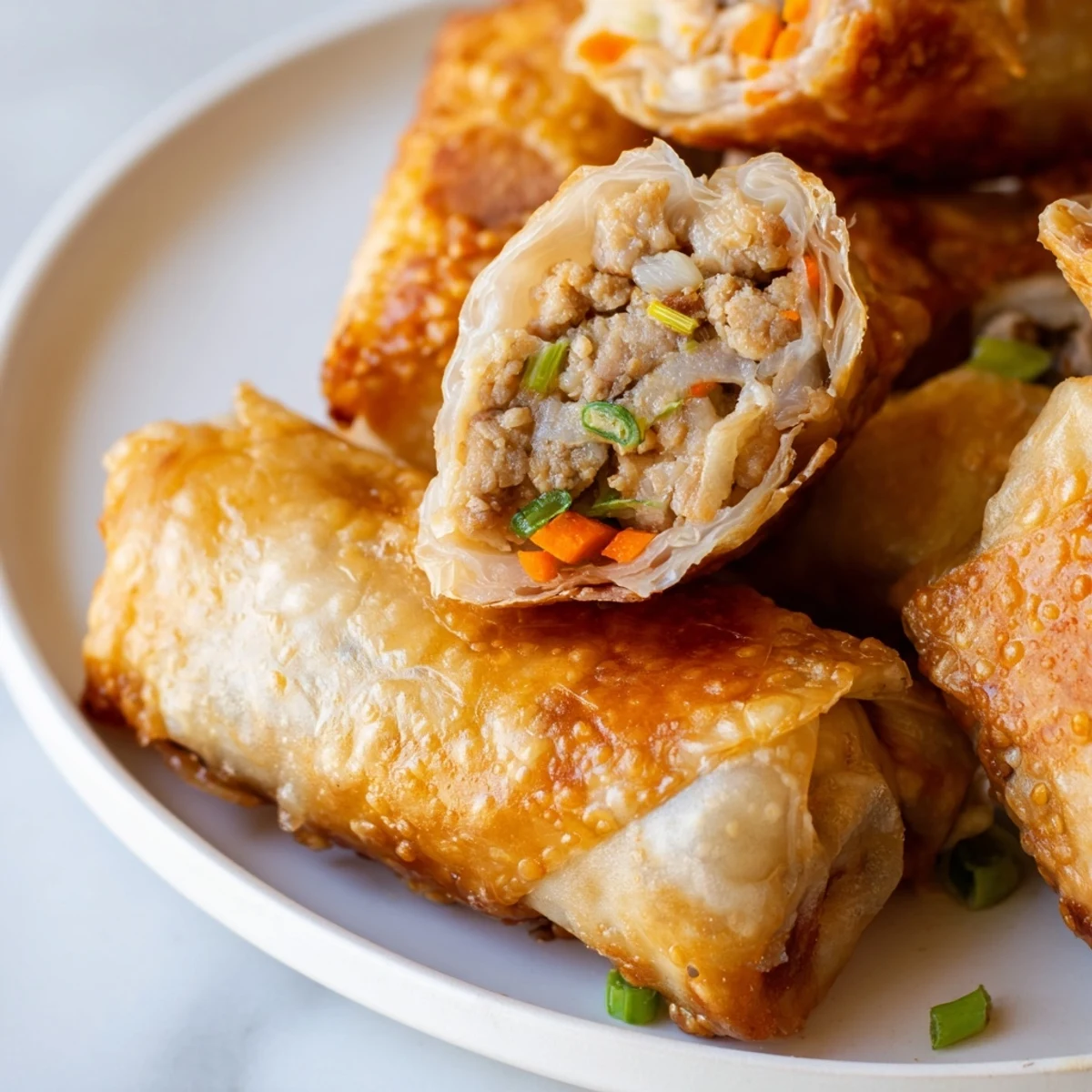 Golden and crispy air fryer chicken lumpia bites, a delicious Filipino appetizer, ready to serve and enjoy.