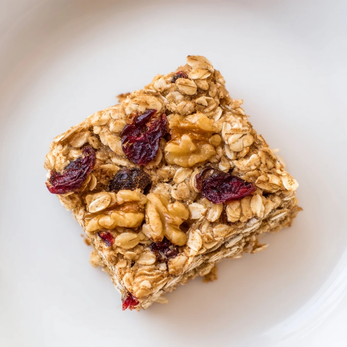 Warm, golden Maple Cinnamon Oatmeal Bars, offering a comforting aroma of baked oats and maple bliss.