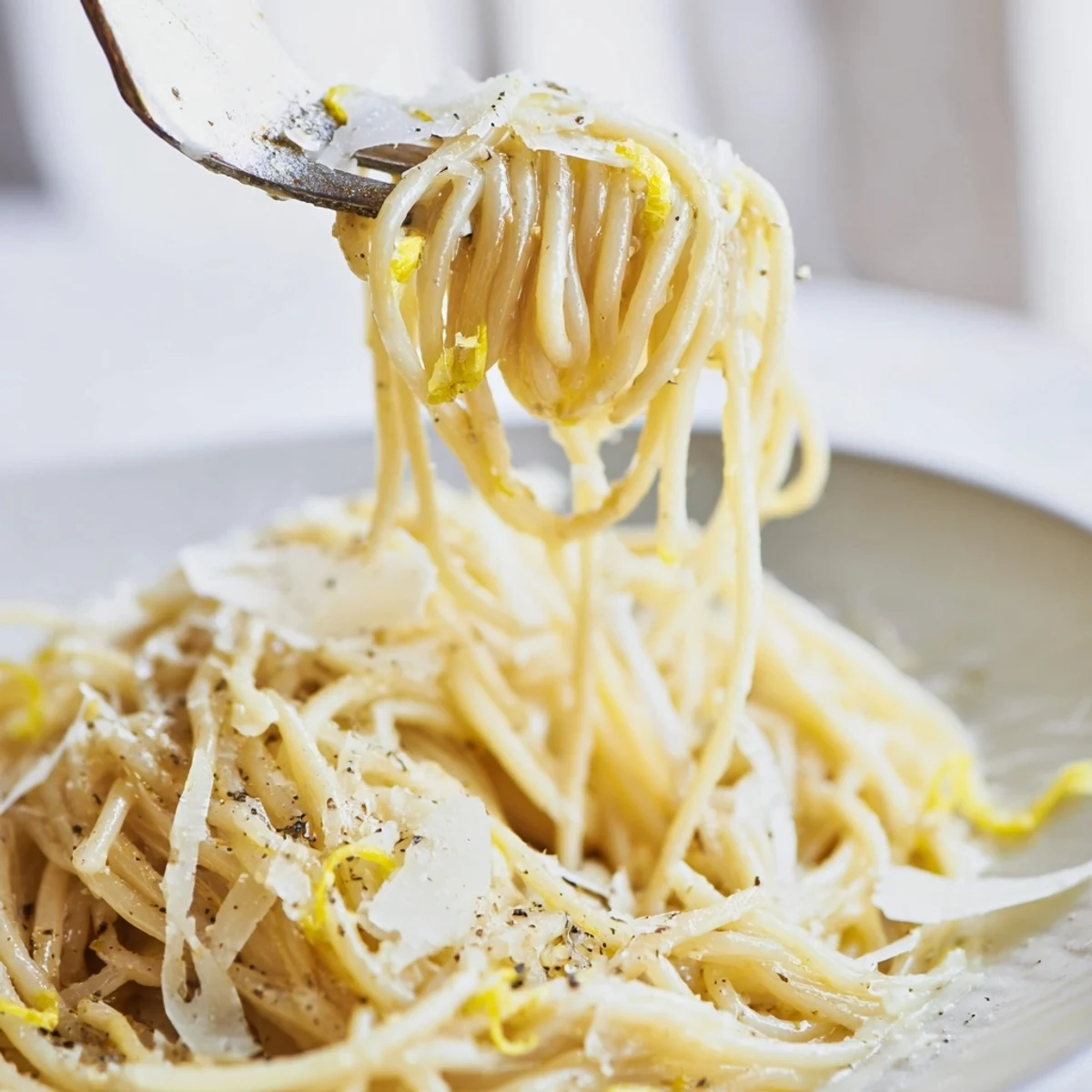 Golden, glossy Lemon Butter Pasta served warm with lemon zest, black pepper, and extra Parmesan on top.