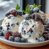 Frozen Yogurt Berry Bark: creamy Greek yogurt topped with vibrant mixed berries, a perfect healthy summer treat.  