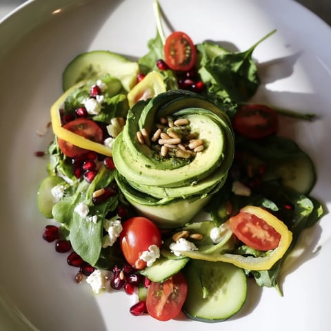A vibrant Golden Ratio Salad, featuring colorful vegetables artistically arranged before serving.