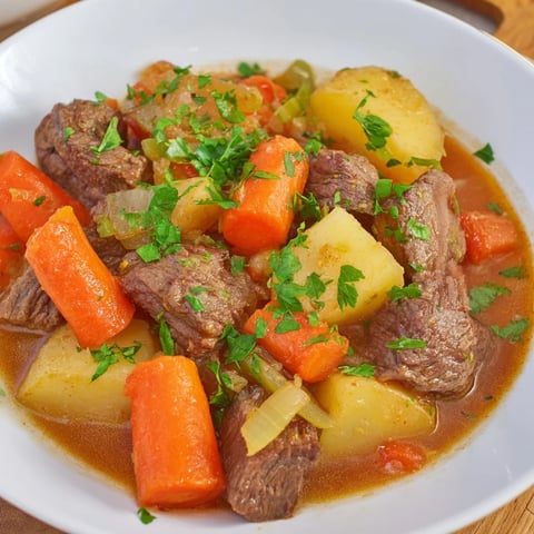 Steaming Irish Beef Stew with tender beef and vegetables, ready to serve and enjoy at dinner.
