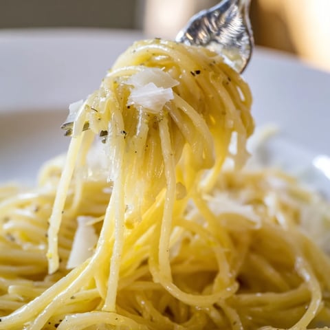 Bright, zesty Lemon Butter Pasta with capellini twirled in a silky sauce, garnished with fresh parsley.