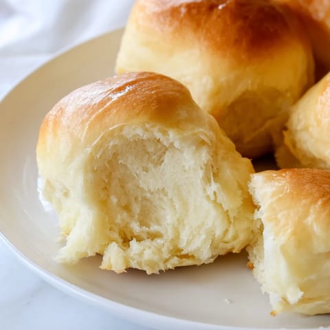 Warm, soft quick-rise dinner rolls with a tender crumb, perfect for soaking up gravy.