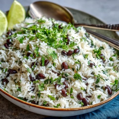 Vibrant coconut lime rice dish with cilantro and tender black beans.