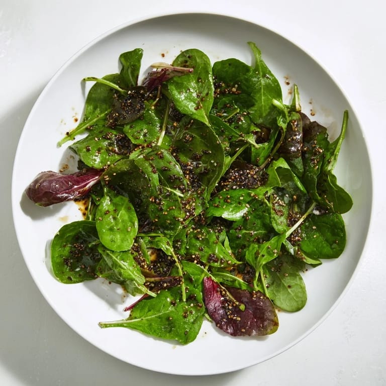 A clear, golden Simple Honey Vinaigrette glistens, ready to be poured over a summer salad.