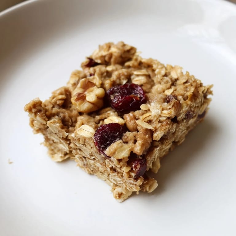 Deliciously chewy Maple Cinnamon Oatmeal Bars; a wholesome breakfast treat with optional pecan topping.