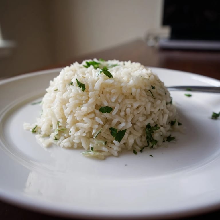 Steaming bowl of homemade Cilantro Lime Rice with zesty lime juice and chopped cilantro, perfect for vegan dinners.