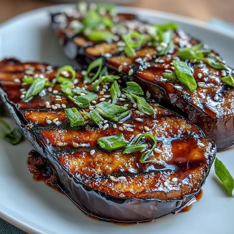 Tender eggplant roasted to perfection, topped with a glossy miso glaze that balances sweetness and savory depth in every bite.