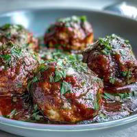 Slow cooker meatballs in marinara sauce, tender and juicy, simmered to perfection in rich tomato flavor.  