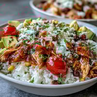 Salsa Chicken Bowls bursting with juicy shredded chicken, vibrant salsa, and colorful toppings served over fluffy rice.